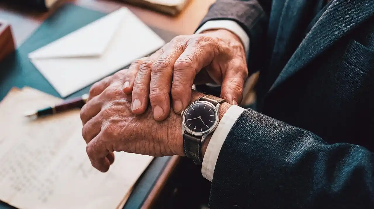 corporate client welcome scene outside a premium Seattle hotel, chauffeur opening the rear door of a black luxury sedan for an arriving executive, polished urban setting with su...