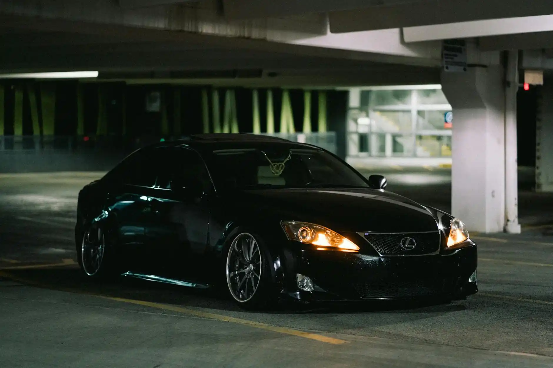executive chauffeur opening rear door of a black luxury sedan outside a glass office tower in downtown Seattle, business traveler with briefcase, clean modern urban setting